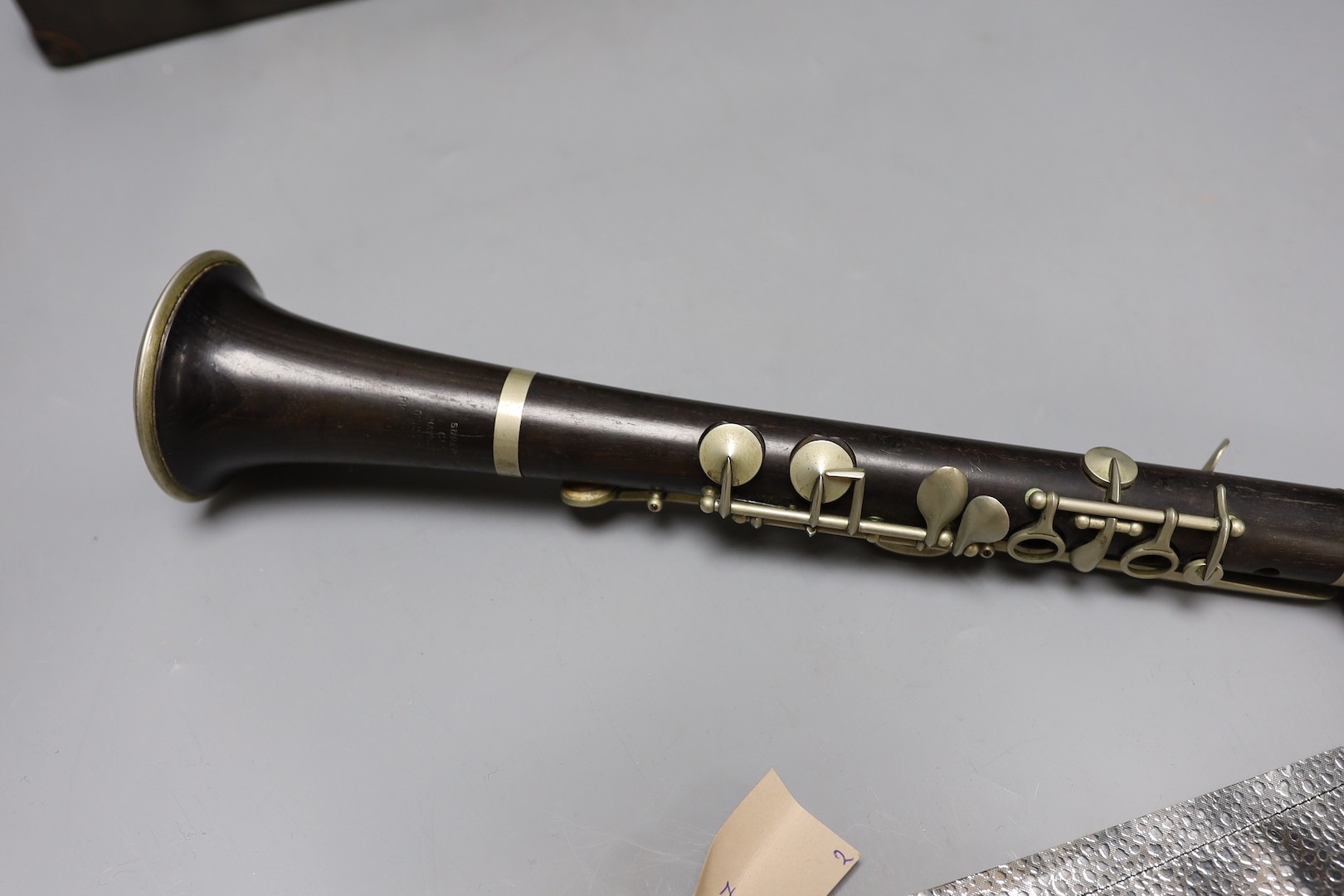 A ‘Superior Class’ Hawkes & Son clarinet and a cased Rampone and Cazzani ‘Judson’ ’ clarinet, 67 cm long.